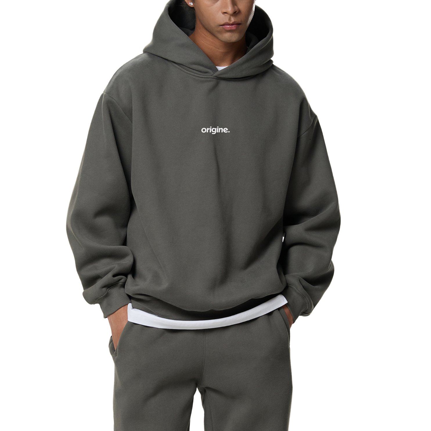Unisex streetwear hoodie from Origine, minimalist oversized design in soft cotton, perfect for everyday wear. Designed for Dreamers – modern essential with subtle urban aesthetic.