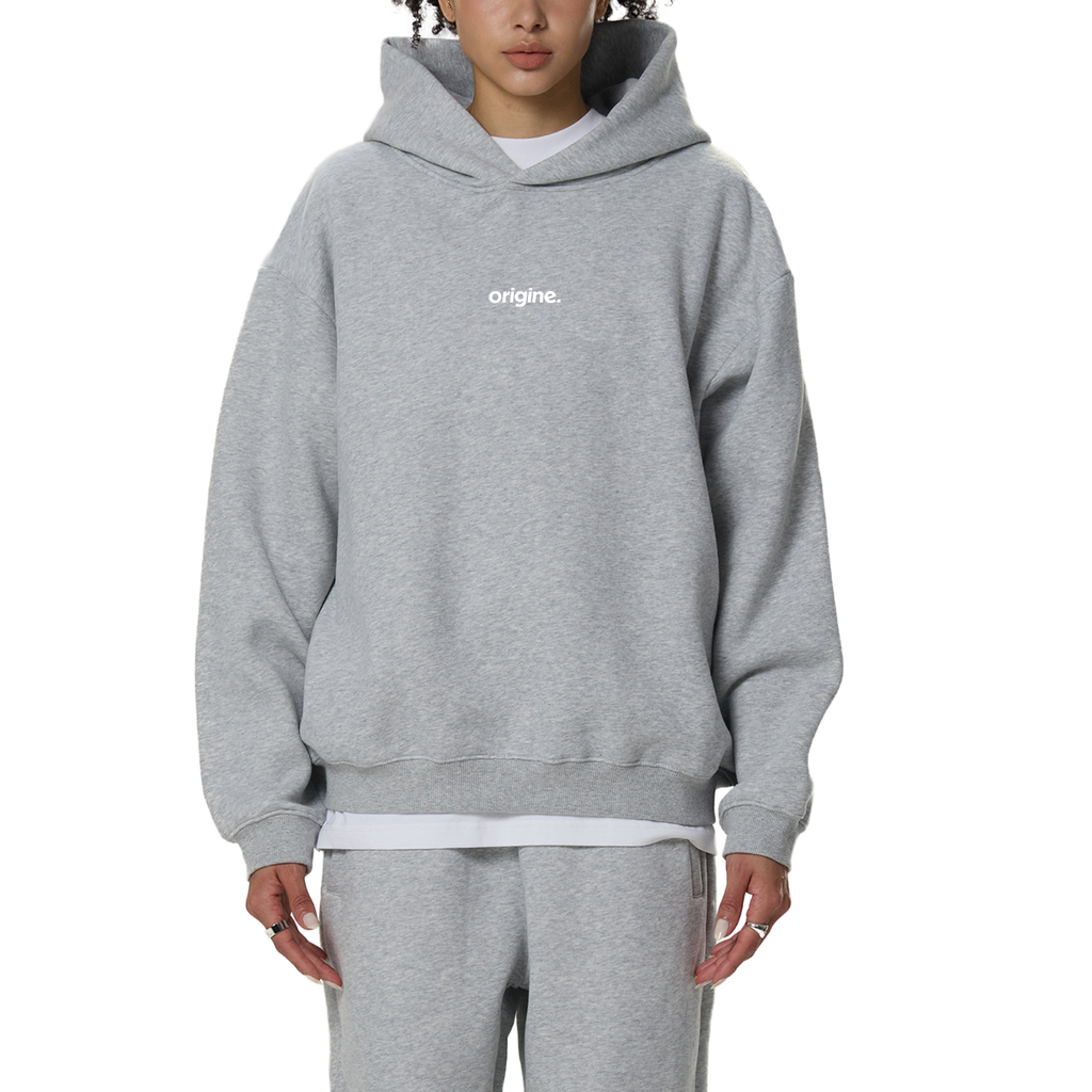 Unisex streetwear hoodie from Origine, minimalist oversized design in soft cotton, perfect for everyday wear. Designed for Dreamers – modern essential with subtle urban aesthetic.
