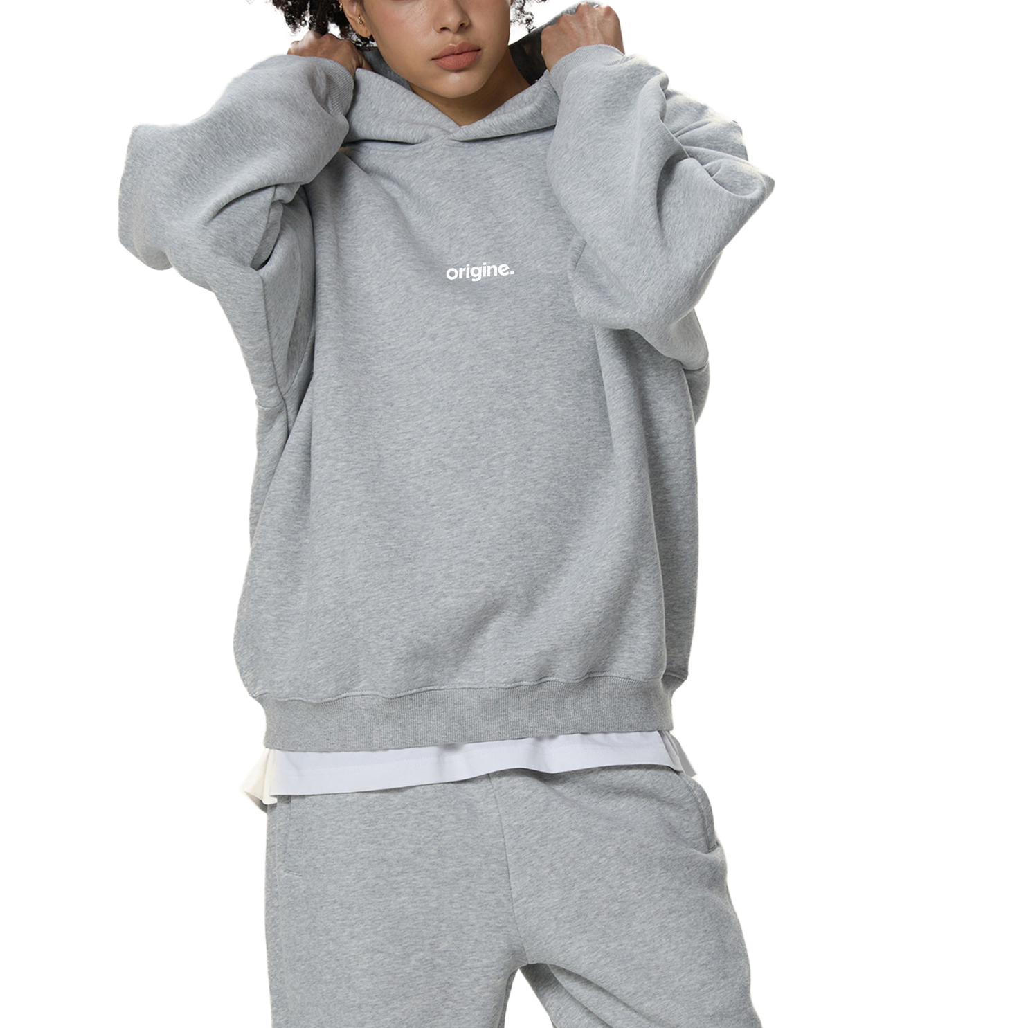 Unisex streetwear hoodie from Origine, minimalist oversized design in soft cotton, perfect for everyday wear. Designed for Dreamers – modern essential with subtle urban aesthetic.