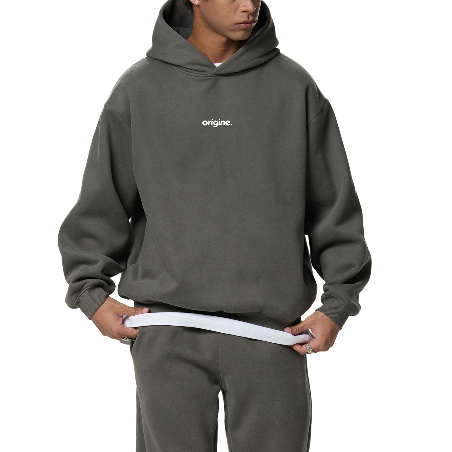 Unisex streetwear hoodie from Origine, minimalist oversized design in soft cotton, perfect for everyday wear. Designed for Dreamers – modern essential with subtle urban aesthetic.